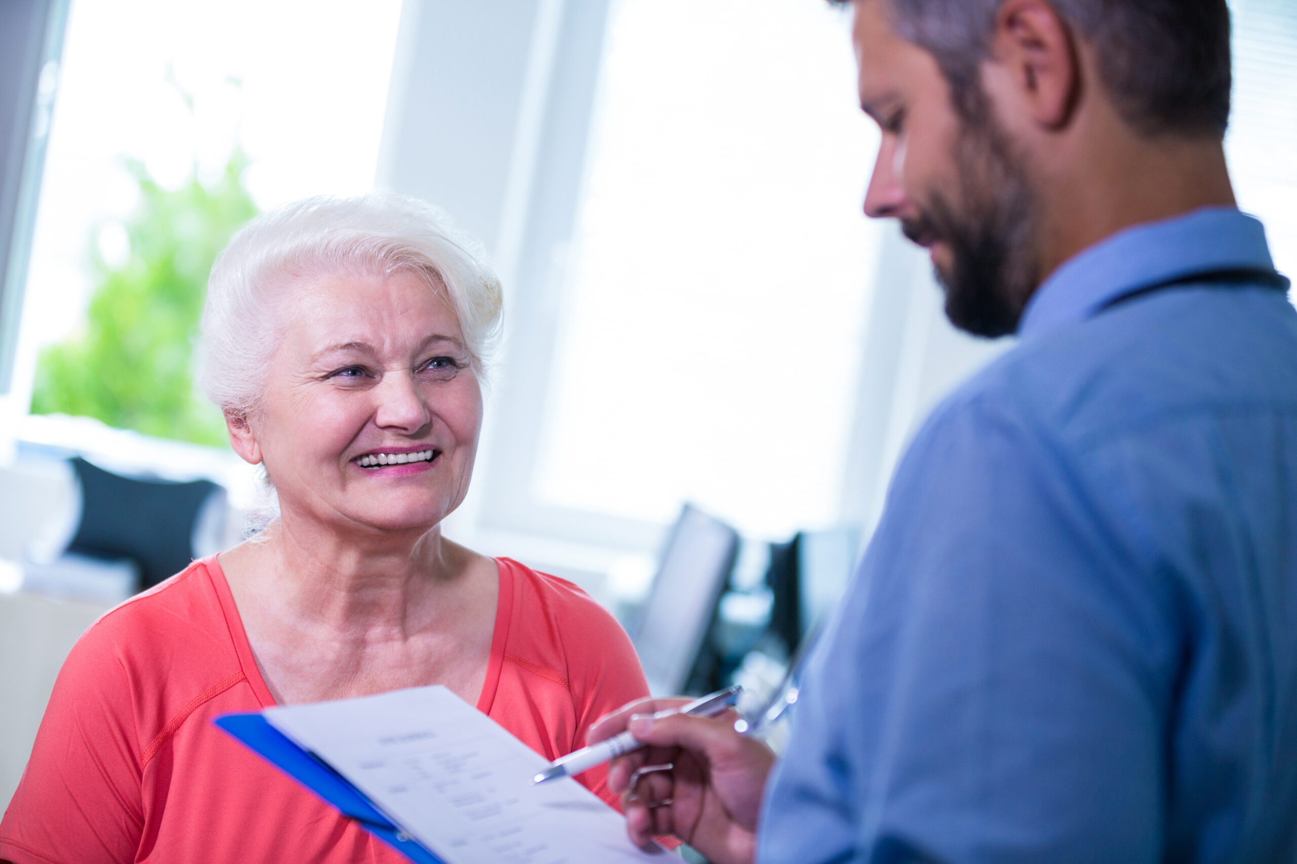 Smiling Senior with Caregiver